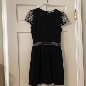 Black cap sleeve white embroider dress